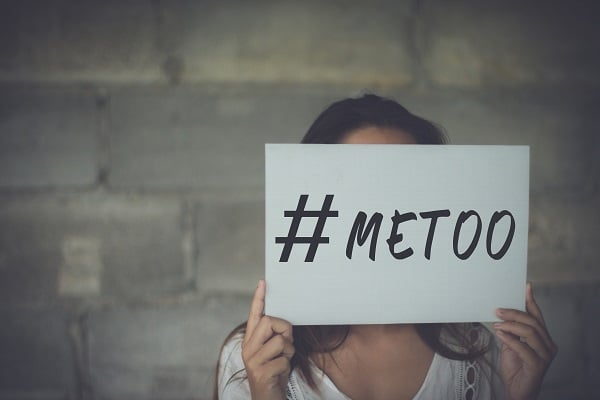 Woman holding up a #MeToo Sign